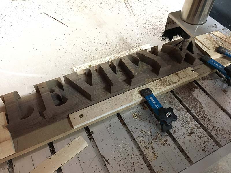 Levity — Carved Black Walnut Sign