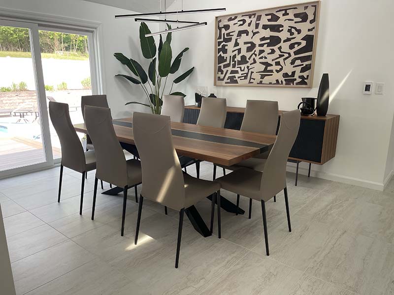 Modern epoxy dining table in a bright dining room